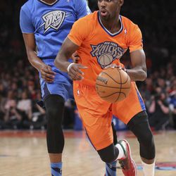 New York Knicks guard Tim Hardaway Jr. dribbles past Oklahoma City Thunder forward Kevin Durantduring the first half of an NBA basketball game at Madison Square Garden, Wednesday, Dec. 25, 2013, in New York. 