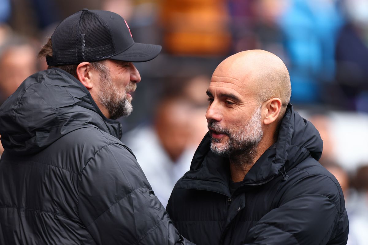 Jurgen Klopp the head coach / manager of Liverpool and Pep Guardiola the head coach / manager of Manchester City during the Premier League match between Manchester City and Liverpool at Etihad Stadium on April 10, 2022 in Manchester, United Kingdom.