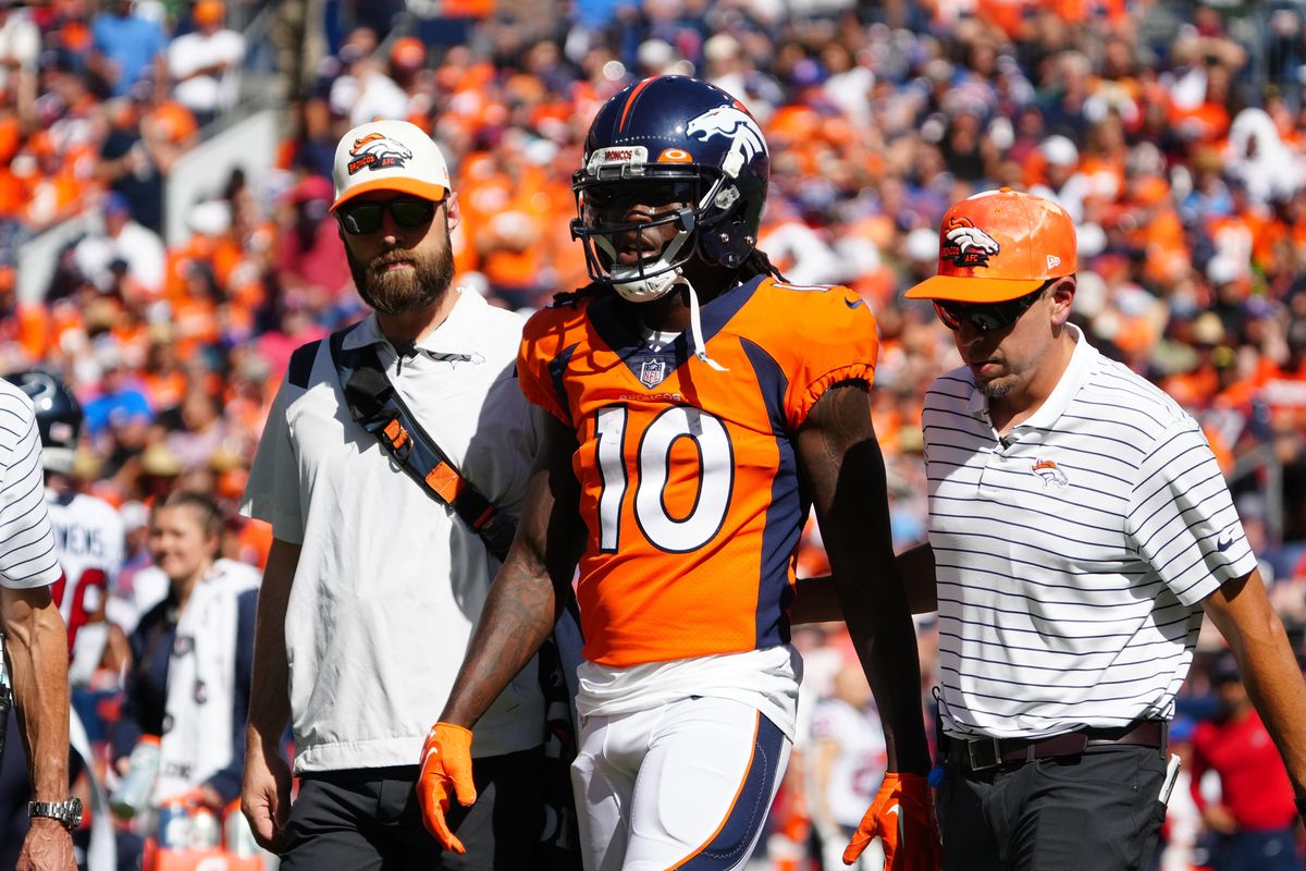 Denver Broncos wide receiver Jerry Jeudy (10) leaves the field in the first quarter against the Denver Broncos at Empower Field at Mile High. Mandatory Credit: Ron Chenoy