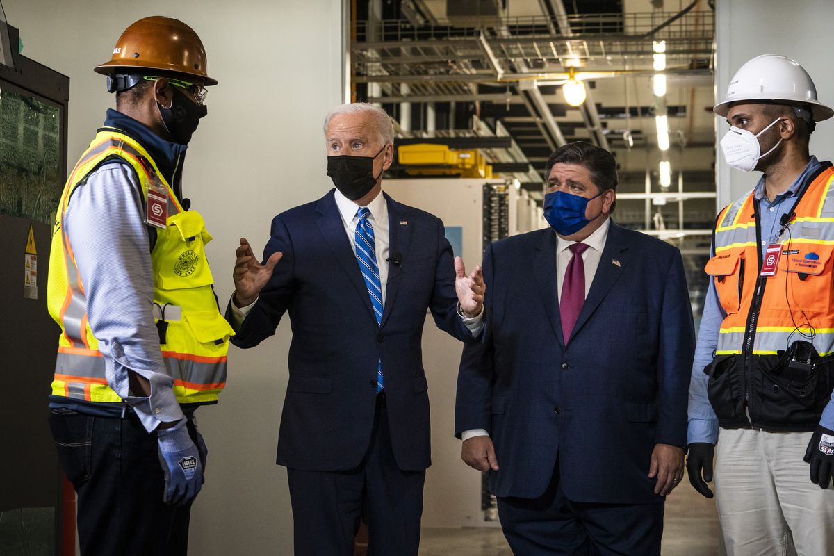 President Joe Biden joins Gov. J.B. Pritzker and workers on a tour of a data center under construction by Clayco in Elk Grove Village last month.