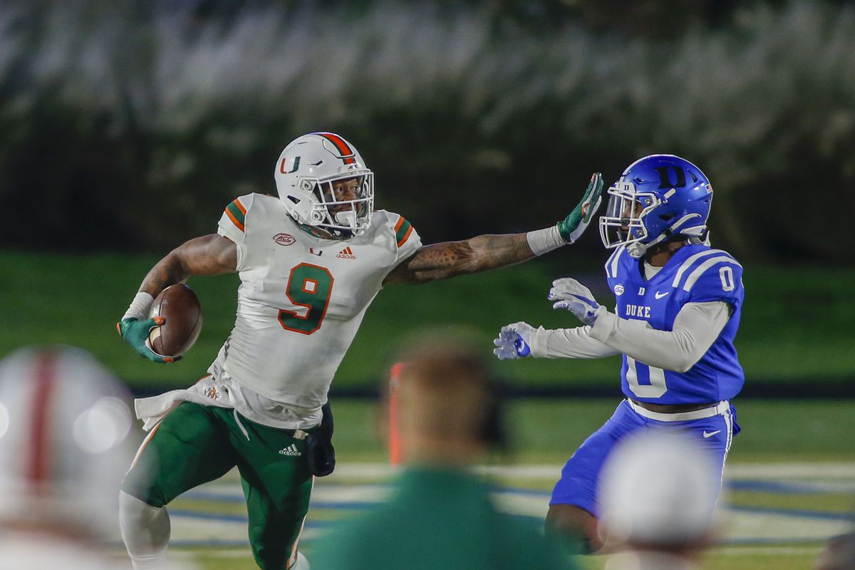 Miami Hurricanes tight end Brevin Jordan carries the football against Duke Blue Devils safety Marquis Waters in the first half at Wallace Wade Stadium.&nbsp;