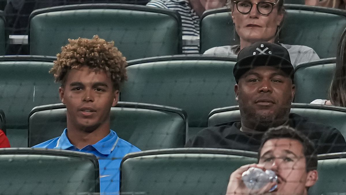 Druw Jones, with dad Andruw on right, take in an MLB game.