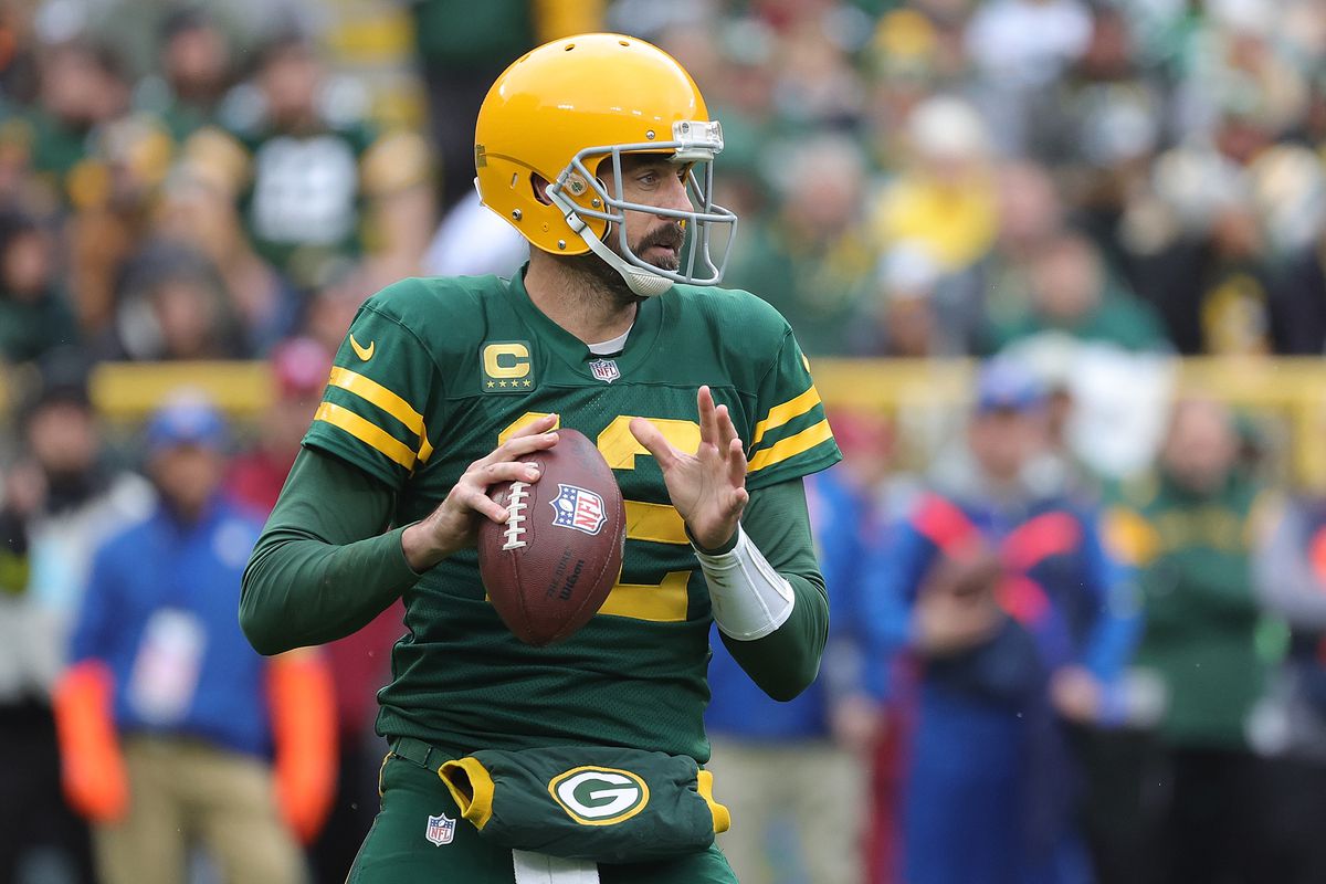 Aaron Rodgers of the Green Bay Packers looks to pass during a game against the New York Jets at Lambeau Field on October 16, 2022 in Green Bay, Wisconsin. The Jets defeated the Packers 27-10.