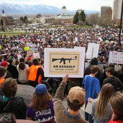 Protesters with the "March for Our Lives" rally gather on the steps of the state Capitol in Salt Lake City on Saturday, March 24, 2018. Thousands of protesters marched from West High School to the state Capitol to advocate for stricter gun control laws.