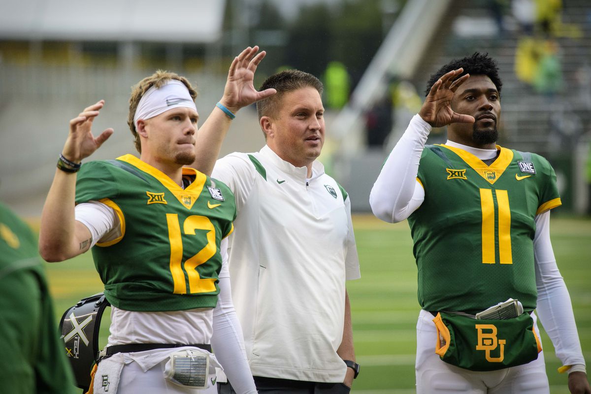 Baylor Bears quarterback coach Shawn Bell stands with quarterback Blake Shapen and quarterback Gerry Bohanon after the game against the Texas Tech Red Raiders at McLane Stadium.