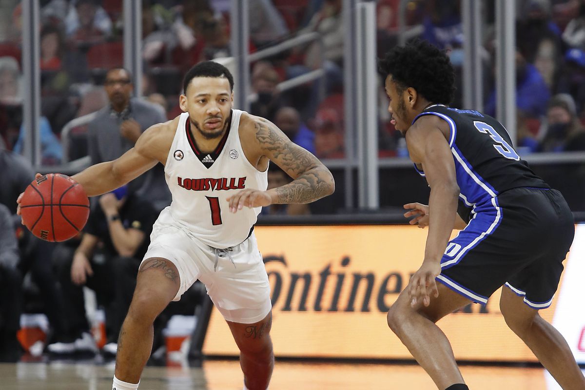 Louisville Cardinals guard Carlik Jones is defended by Duke Blue Devils guard Jeremy Roach during a NCAA basketball game at the KFC Yum! Center.&nbsp;