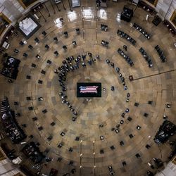 Members of Congress surround the casket of former Sen. Harry Reid, D-Nev., as he lies in state in the Rotunda of the U.S. Capitol, Wednesday, Jan. 12, 2022, in Washington.