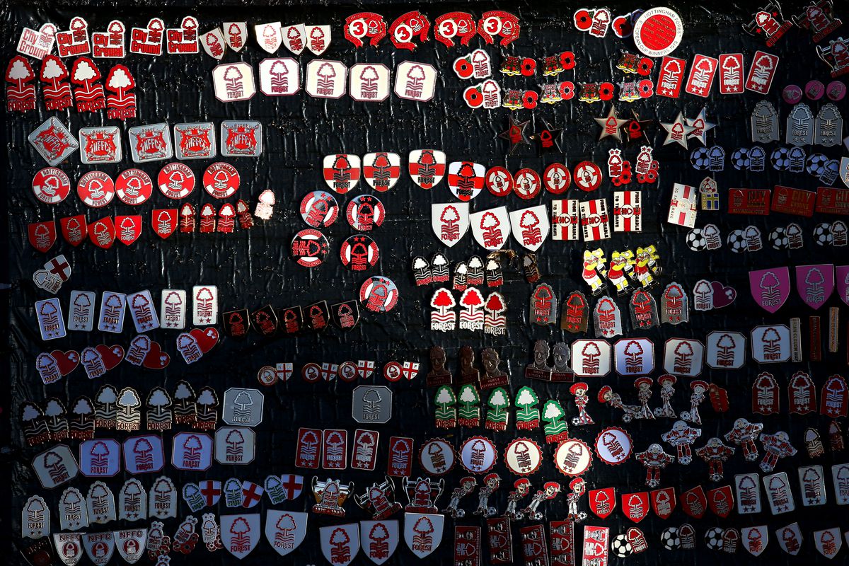 A detailed view of pin badges for sale outside the stadium prior to the Emirates FA Cup Fourth Round match between Nottingham Forest and Leicester City at City Ground on February 06, 2022 in Nottingham, England.