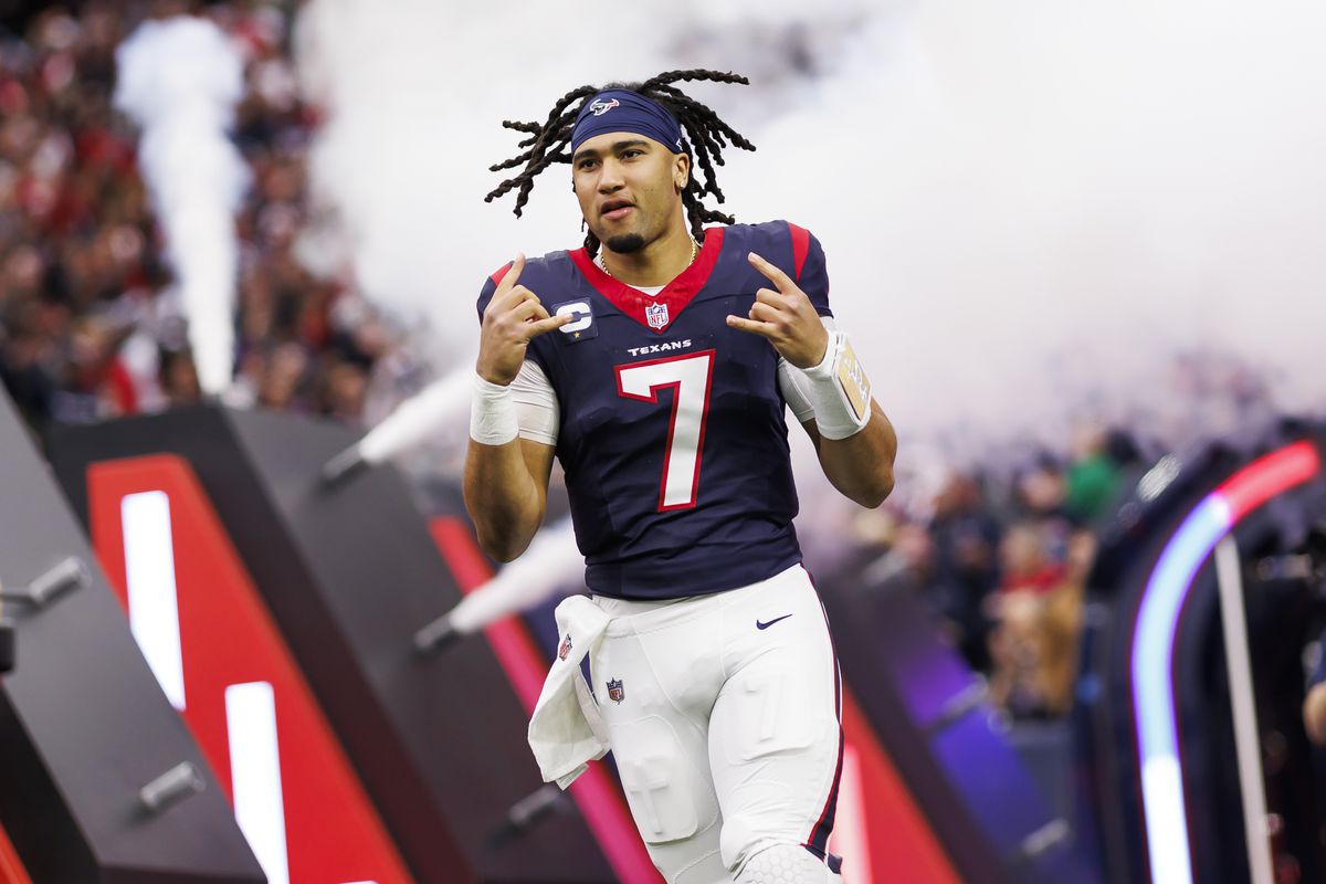 C.J. Stroud #7 of the Houston Texans celebrates as he runs onto the field during player introductions before an AFC wild-card playoff football game against the Cleveland Browns at NRG Stadium on January 13, 2024 in Houston, Texas.