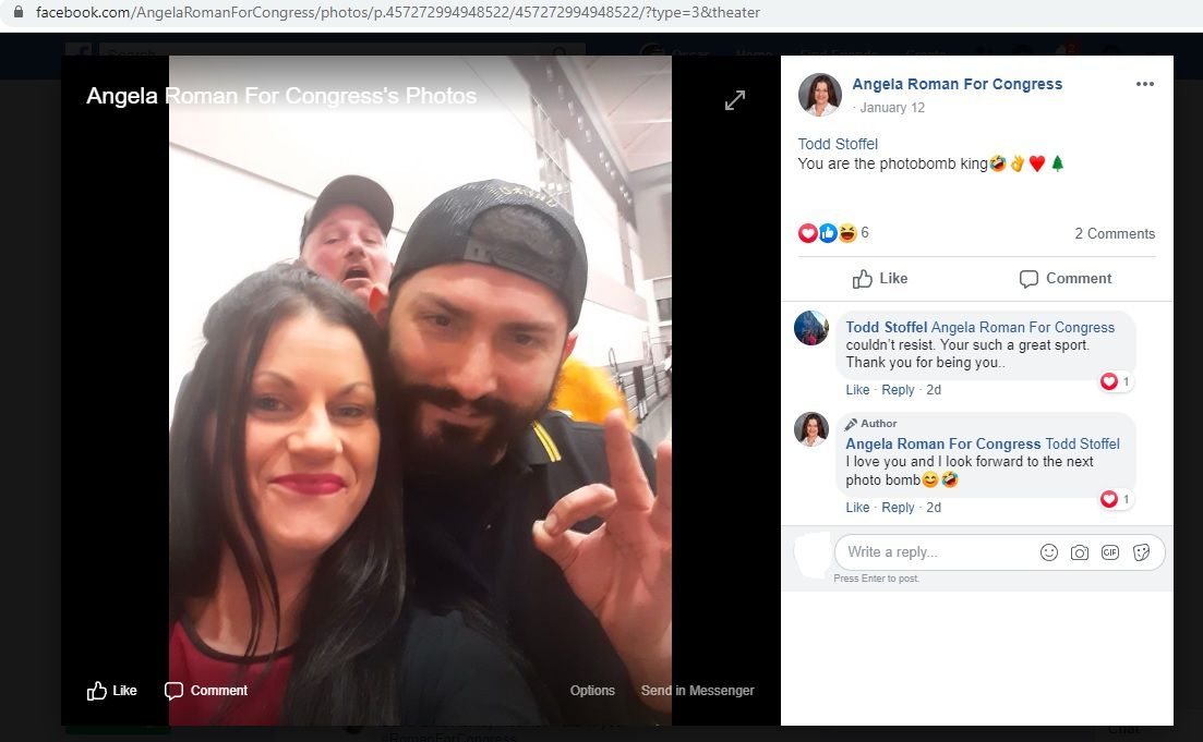 Angela Roman and Proud Boy Matteo Dagradi making the white-power “ok” sign, with Todd Stoffel in the background, at the Vanguards of Victory ceremony.