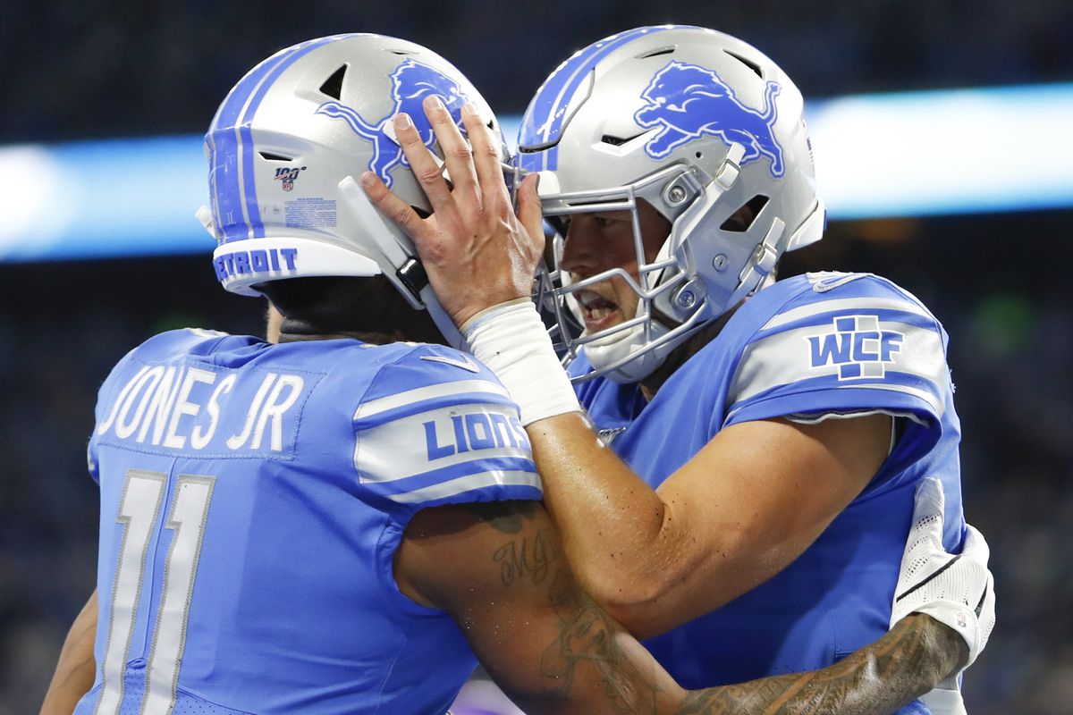 Detroit Lions quarterback Matthew Stafford celebrates with wide receiver Marvin Jones after the pair combine for a touchdown during the second quarter against the Minnesota Vikings at Ford Field.