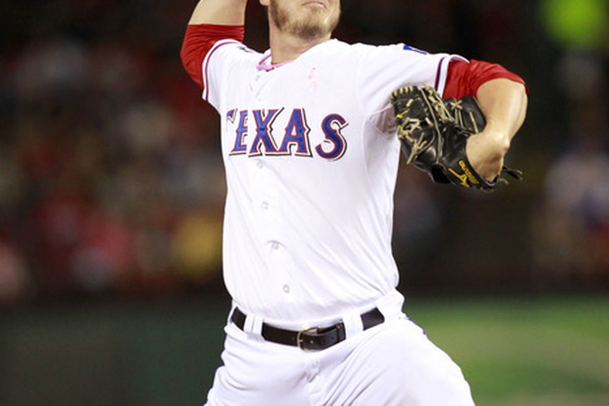 May 13, 2012; Arlington, TX, USA; Texas Rangers pitcher Mark Lowe (57) throws a pitch during the 7th inning of the game against the Los Angeles Angels at Rangers Ballpark. The Rangers beat the Angels 13-6.  Mandatory Credit: Tim Heitman-US PRESSWIRE