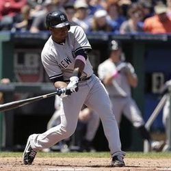 New York Yankees' Chris Nelson bats during the fifth inning of a baseball game against the Kansas City Royals Sunday, May 12, 2013, in Kansas City, Mo. (AP Photo/Charlie Riedel)