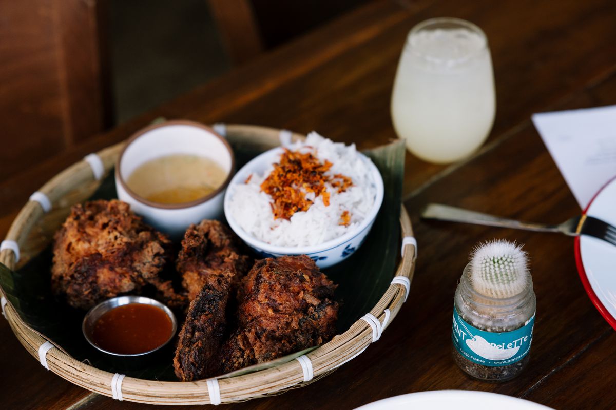 A plate of fried chicken at Rangoon Bistro comes with rice and dipping sauce.