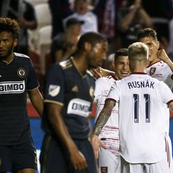 A group of Real Salt Lake players celebrate after midfielder Albert Rusnak (11) scores the third goal of the night during the second half of a game at Rio Tinto Stadium in Sandy on Saturday, July 13, 2019.