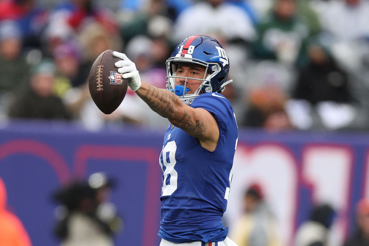 Isaiah Hodgins #18 of the New York Giants in action against the Philadelphia Eagles during their game at MetLife Stadium on December 11, 2022 in East Rutherford, New Jersey.