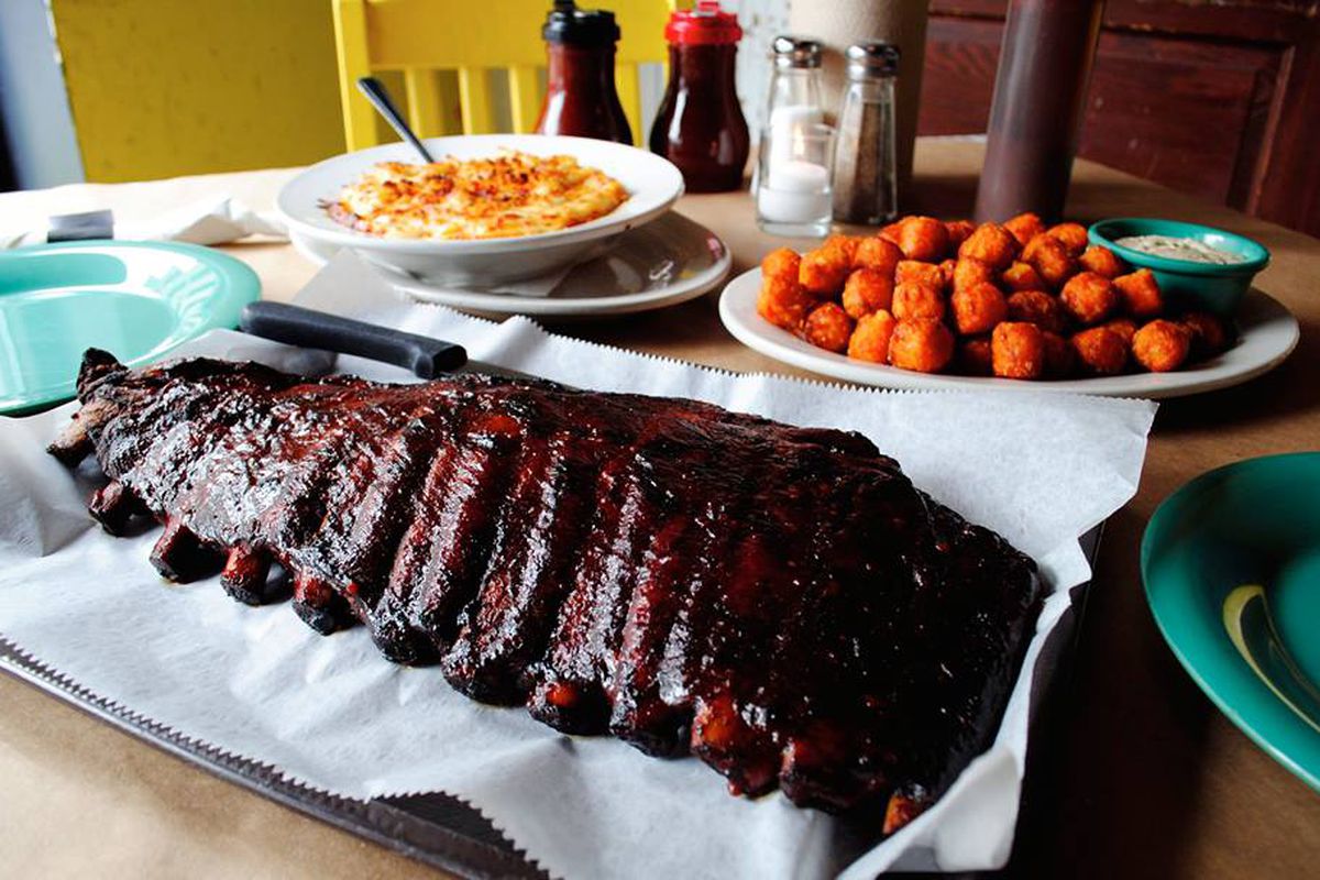 A plate of barbecue ribs with sides.