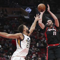 Portland Trail Blazers forward Larry Nance Jr. shoots over Utah Jazz center Rudy Gobert during the second half of an NBA basketball game in Portland, Ore., Wednesday, Dec. 29, 2021. 