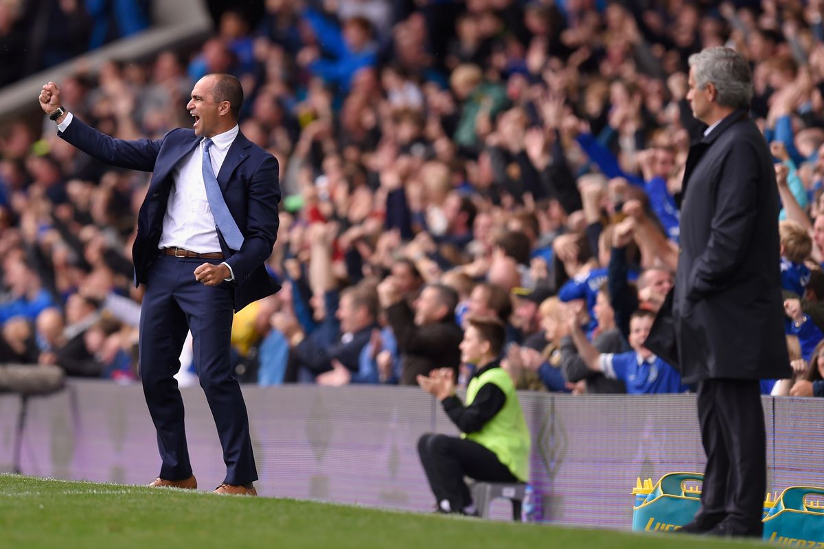 Roberto Martinez celebrates a goal while Jose Mourinho can only look on dejectedly.