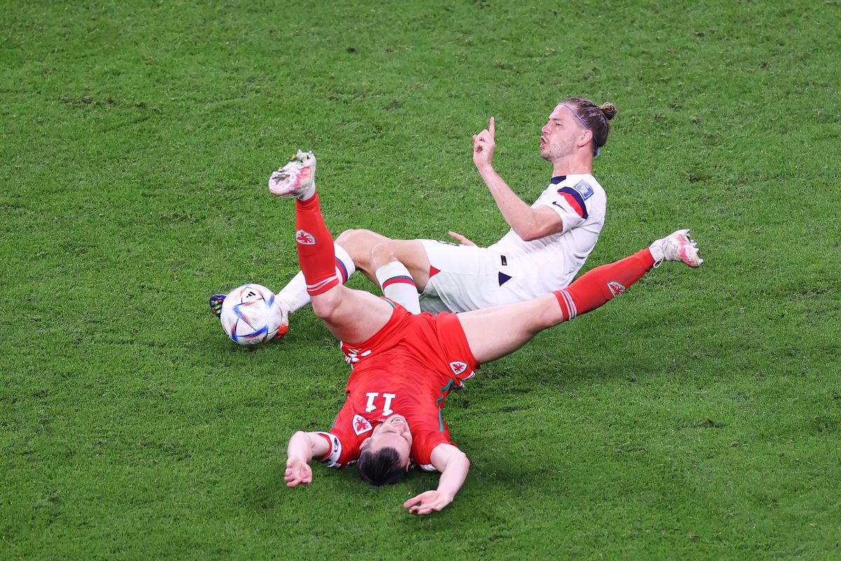 Gareth Bale of Wales is brought down by Walker Zimmerman of United States in the box resulting in a penalty kick during the FIFA World Cup Qatar 2022 Group B match between USA and Wales at Ahmad Bin Ali Stadium on November 21, 2022 in Doha, Qatar.