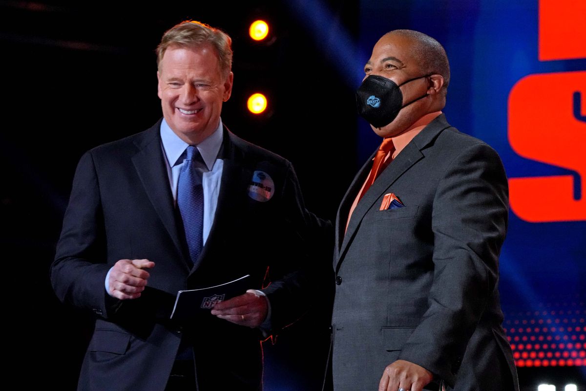 NFL commissioner Roger Goodell with special draft announcer Carlos Nelson in the first round of the 2021 NFL Draft at First Energy Stadium.