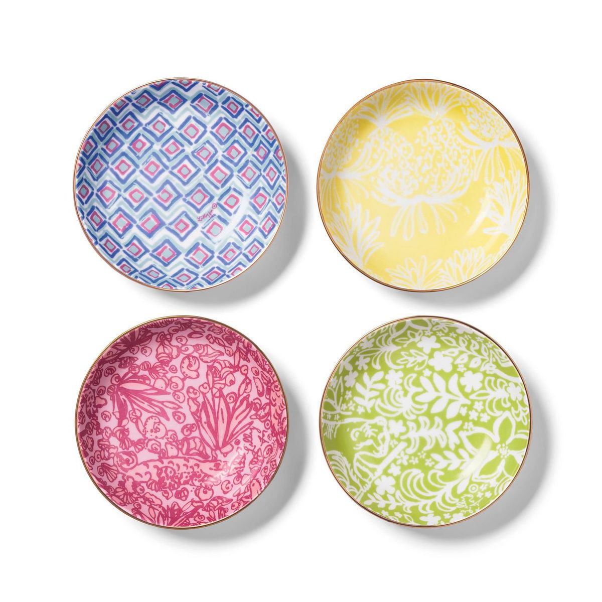 Top view of four round bowls with light colorful designs. 