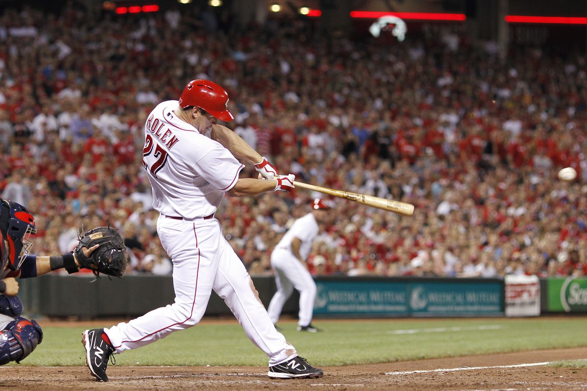 SCOTT ROLEN  of the Cincinnati Reds singles to drive in two runs in the eighth inning of the game against the CARDINALS.