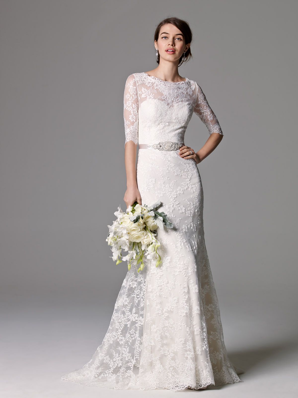 A model wearing a lace wedding dress