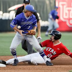 BYU's Brennon Anderson bobbles the ball, allowing Utah's DaShawn Keirsey, Jr. to double during a game at Smith's Ballpark in Salt Lake City on Tuesday, May 8, 2018.