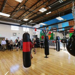 Members of the media look over the boxing gym at the South Salt Lake Central Park Community Center on Thursday, Sept. 29, 2016. The state's latest report on intergenerational poverty released Thursday found one-third of Utahns experiencing intergenerational poverty are spending half of their household incomes on housing.