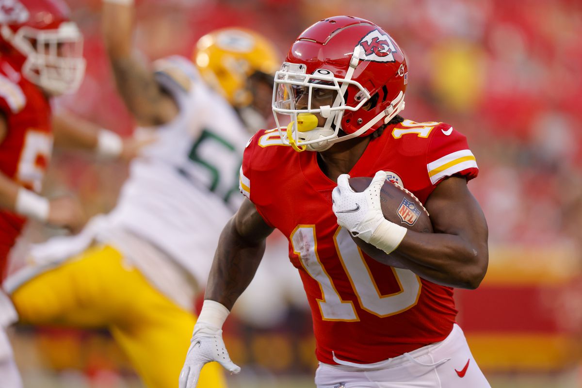 KANSAS CITY, MO - AUGUST 25: Isiah Pacheco #10 of the Kansas City Chiefs runs with the football during first quarter preseason game action against the Green Bay Packers at Arrowhead Stadium on August 25, 2022 in Kansas City, Missouri.