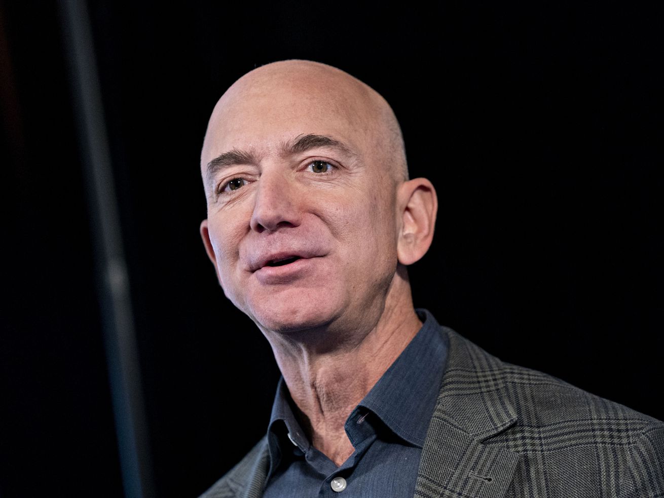 A close-up of Amazon CEO Jeff Bezos’s face with a neutral expression.