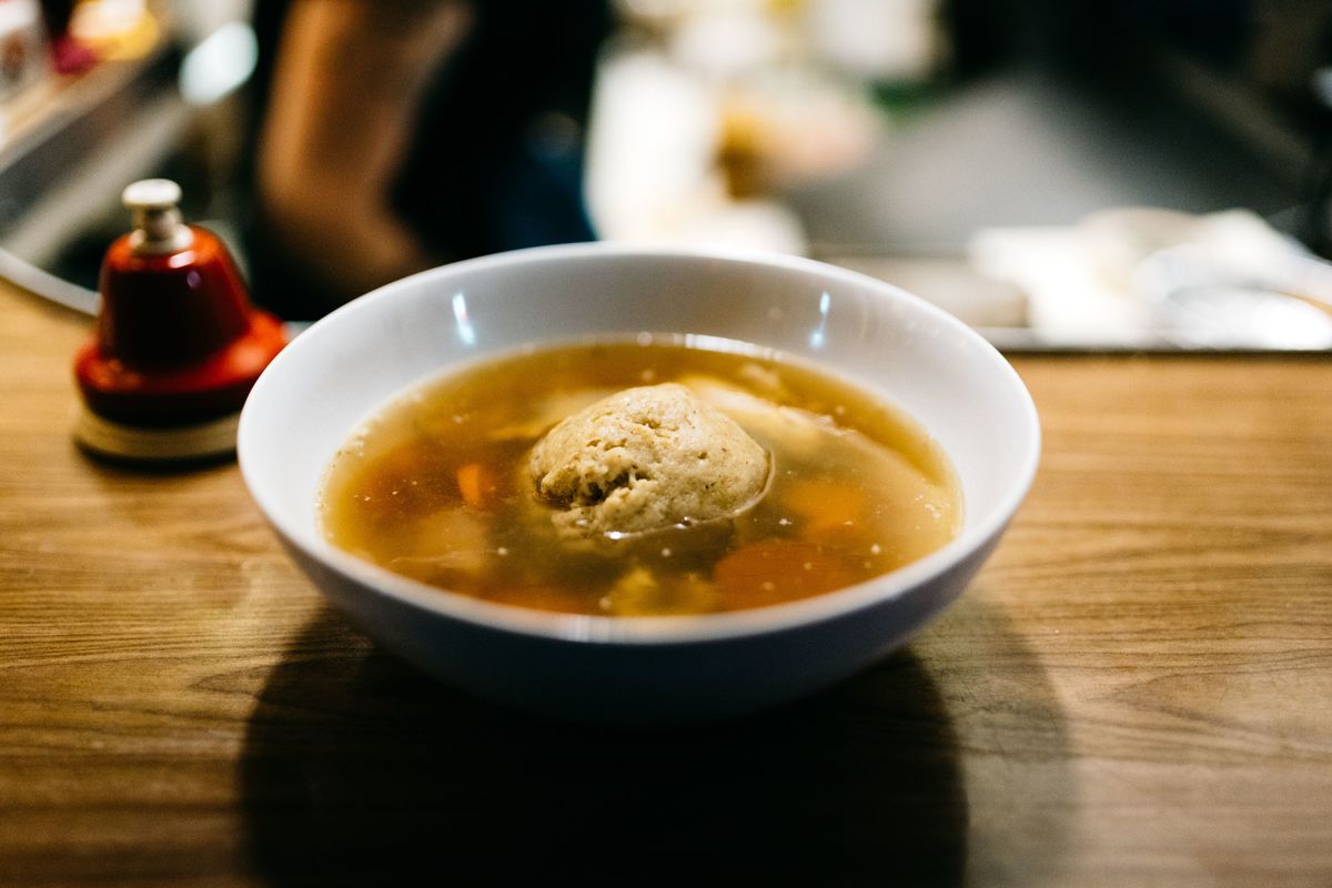 A bowl of matzah ball soup.