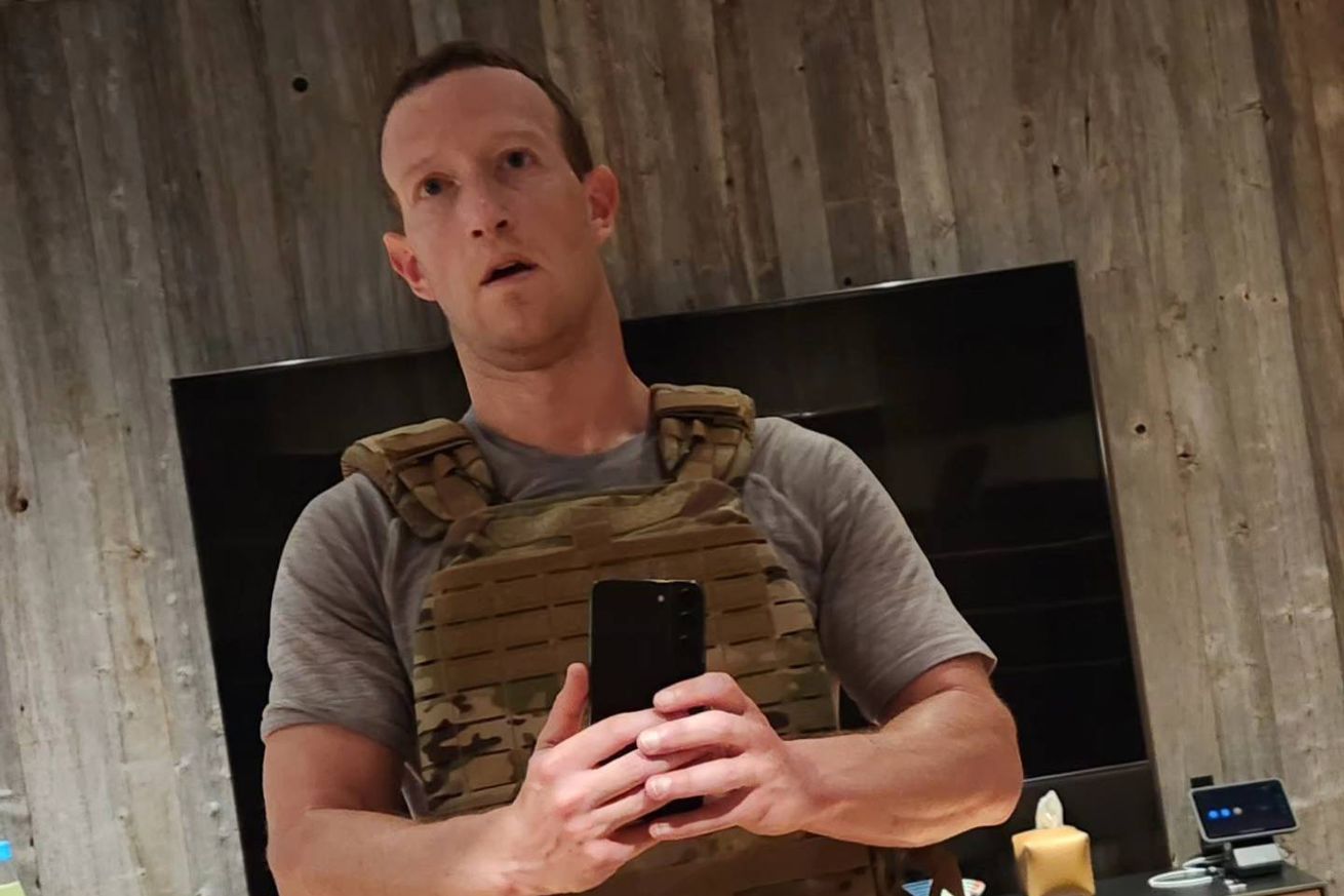 Mark Zuckerberg posing with a weighted vest on.