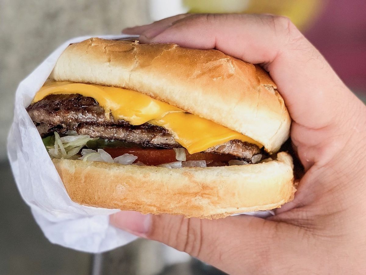 A handheld burger with lots of cheese from Bill’s Burgers in the San Fernando Valley.