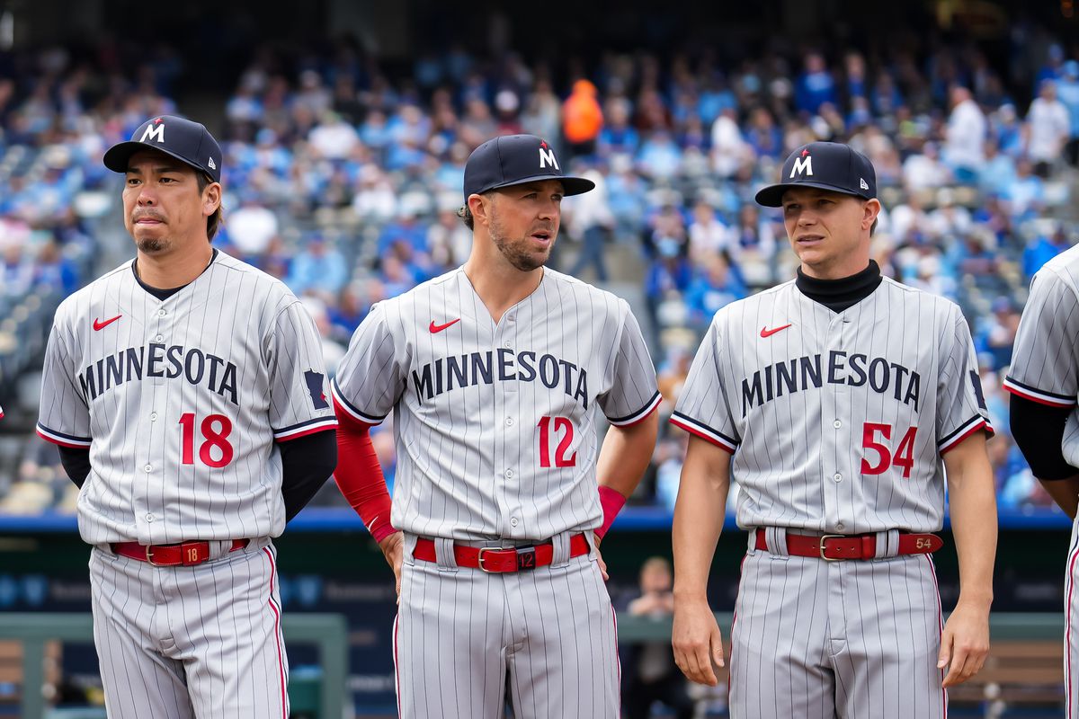 Kenta Maeda and Sonny Gray, who signed free agent deals this week, seen here flanking old friend Kyle Farmer for the Twins on opening day 2023.