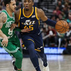 Utah Jazz guard Donovan Mitchell (45) moves against Boston Celtics guard Shane Larkin (8) at Vivint Smart Home Arena in Salt Lake City on Wednesday, March 28, 2018.