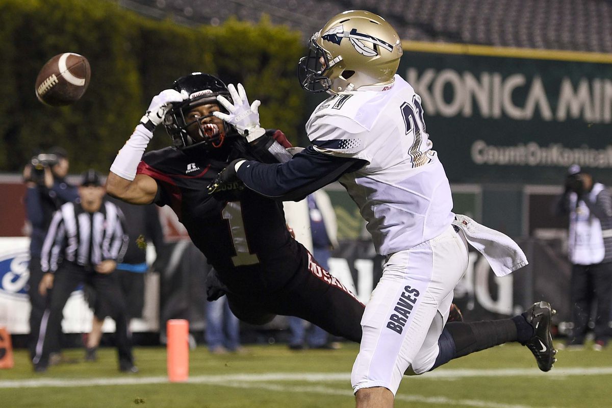 Mykal Tolliver (right) defends a pass while playing for the St. John Bosco Braves