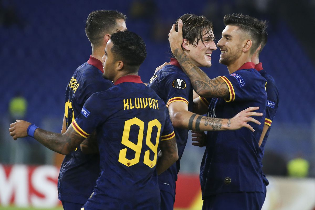 Roma’s Italian midfielder Nicolo Zaniolo (2nd R) celebrates...