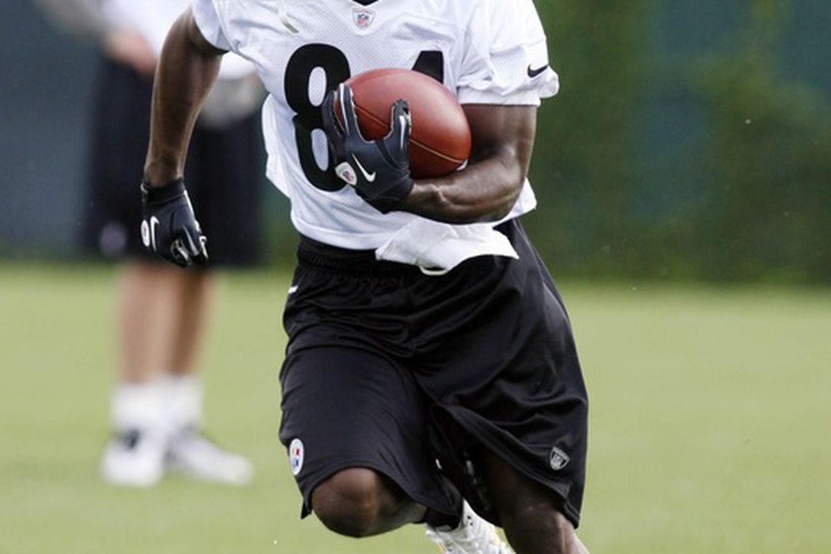 May 22, 2012; Pittsburgh, PA, USA; Pittsburgh Steelers wide receiver Antonio Brown (84) runs after a pass reception during organized team activities at the Steelers training facility. Mandatory Credit: Charles LeClaire-US PRESSWIRE