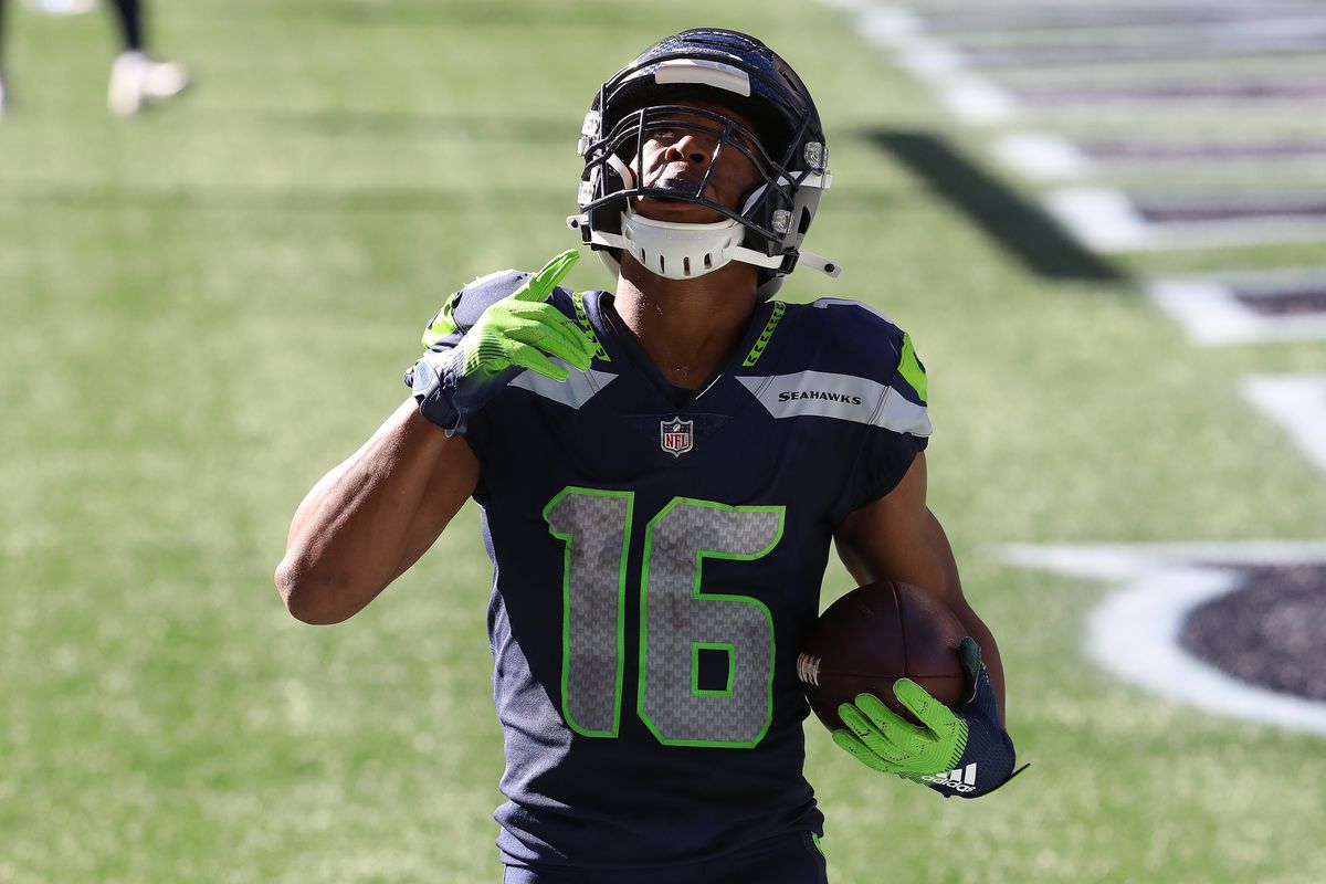 Tyler Lockett #16 of the Seattle Seahawks celebrates in the end zone after scoring a touchdown against the Dallas Cowboys during the second quarter in the game at CenturyLink Field on September 27, 2020 in Seattle, Washington.