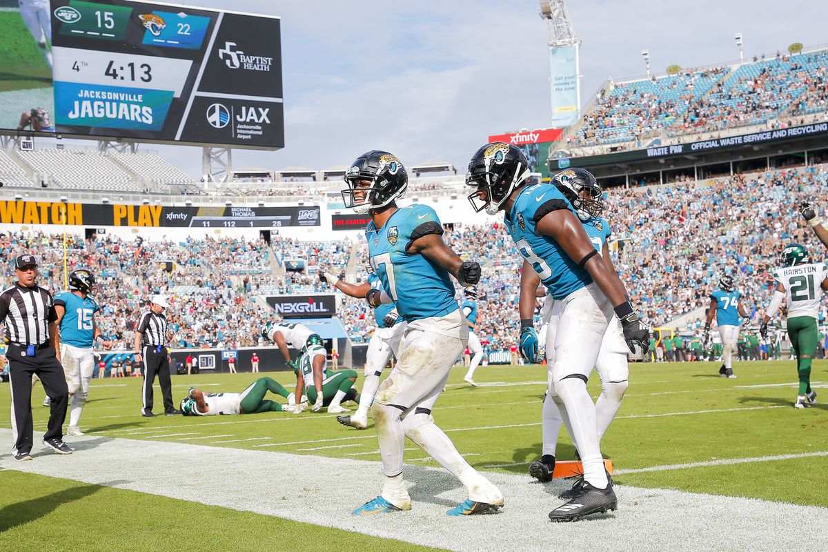 D.J. Chark #17 of the Jacksonville Jaguars celebrates with Chris Conley #18 and teammates after scoring a touchdown during the fourth quarter of a game against the New York Jets at TIAA Bank Field on October 27, 2019 in Jacksonville, Florida.