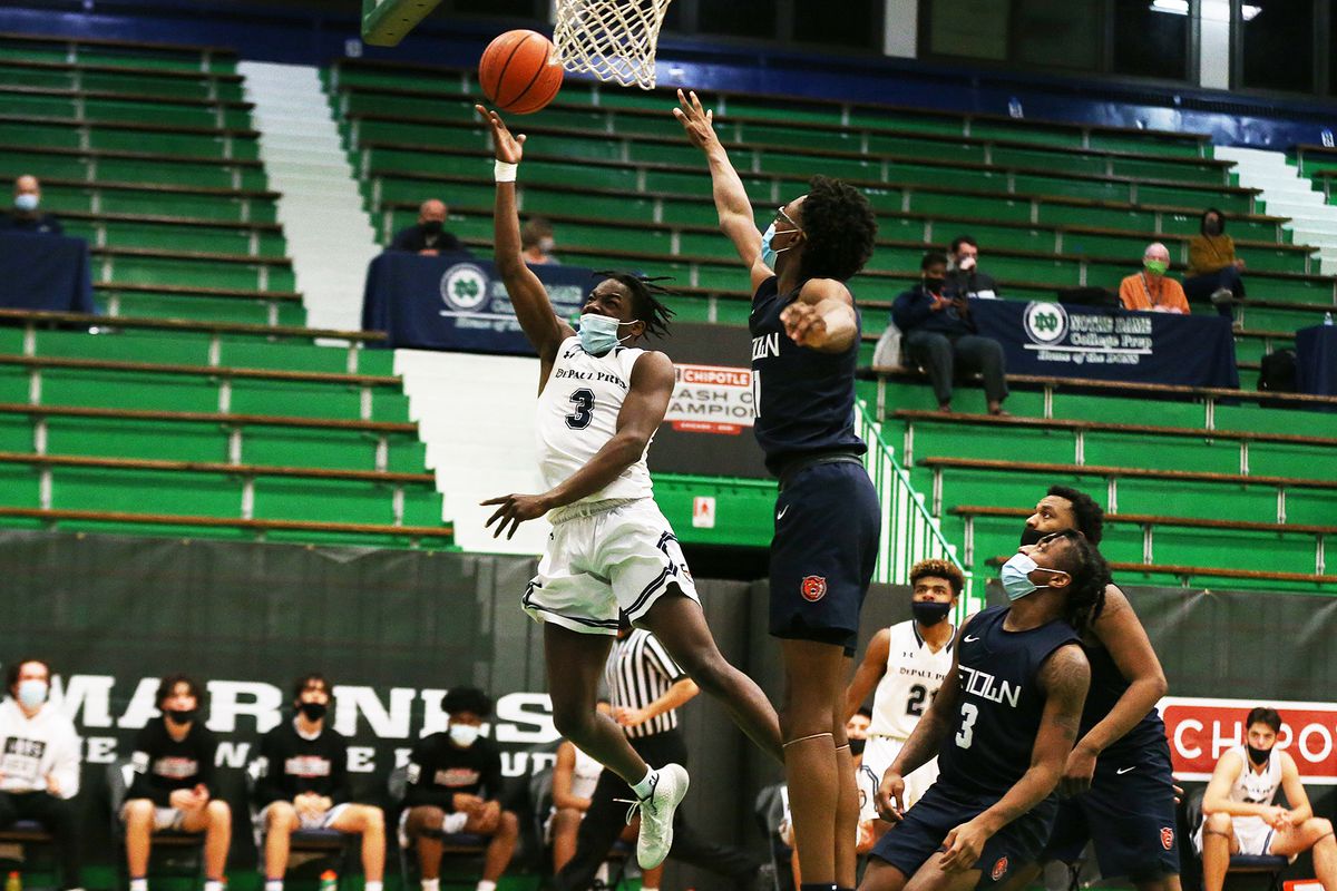 DePaul Prep’s Rasheed Bello (3) switches to his right hand to finish a drive to the basket against Evanston in the Chipotle Classic championship game.