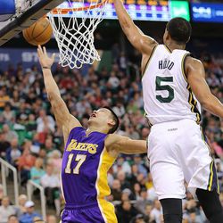 Los Angeles Lakers guard Jeremy Lin (17) puts up a layup with Utah Jazz guard Rodney Hood (5) defending as the Jazz and the Lakers play Wednesday, Feb. 25, 2015, at EnergySolutions Arena in Salt Lake City.