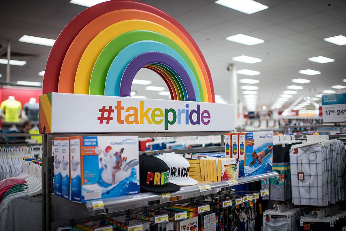 A “Take Pride” campaign in a Target store. A rainbow arcs over a table of merchandise.