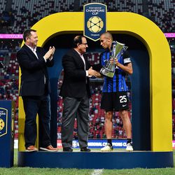 Patrick Murphy, CEO Catalyst Media Group and Minister S.Iswaran and Miranda #25 of FC Interernazionale celebrates with trophy during the International Champions Cup match between FC Internazionale and Chelsea FC at National Stadium on July 29, 2017 in Singapore.