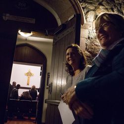 Reverend Susan Roberts, left, and Josie Stone, right, the Interfaith Roundtable Vice Chair, greet attendees of the Interfaith tour as they enter St. Paul's Episcopal Church Wednesday, Feb. 24, 2016 in Salt Lake City. The tour, sponsored by the Salt Lake Interfaith Roundtable, allows patrons from all religious backgrounds to experience and educate themselves on other walks of faith.  