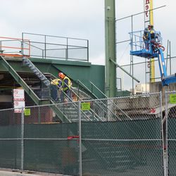 Staircase being dismantled, in the left field bleachers, next to the left field foul pole