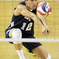 BYU's Jaylen Reyes (12) digs out a serve during a match against the Stanford Cardinal Friday, Jan. 24, 2014, at the Smith Fieldhouse in Provo.