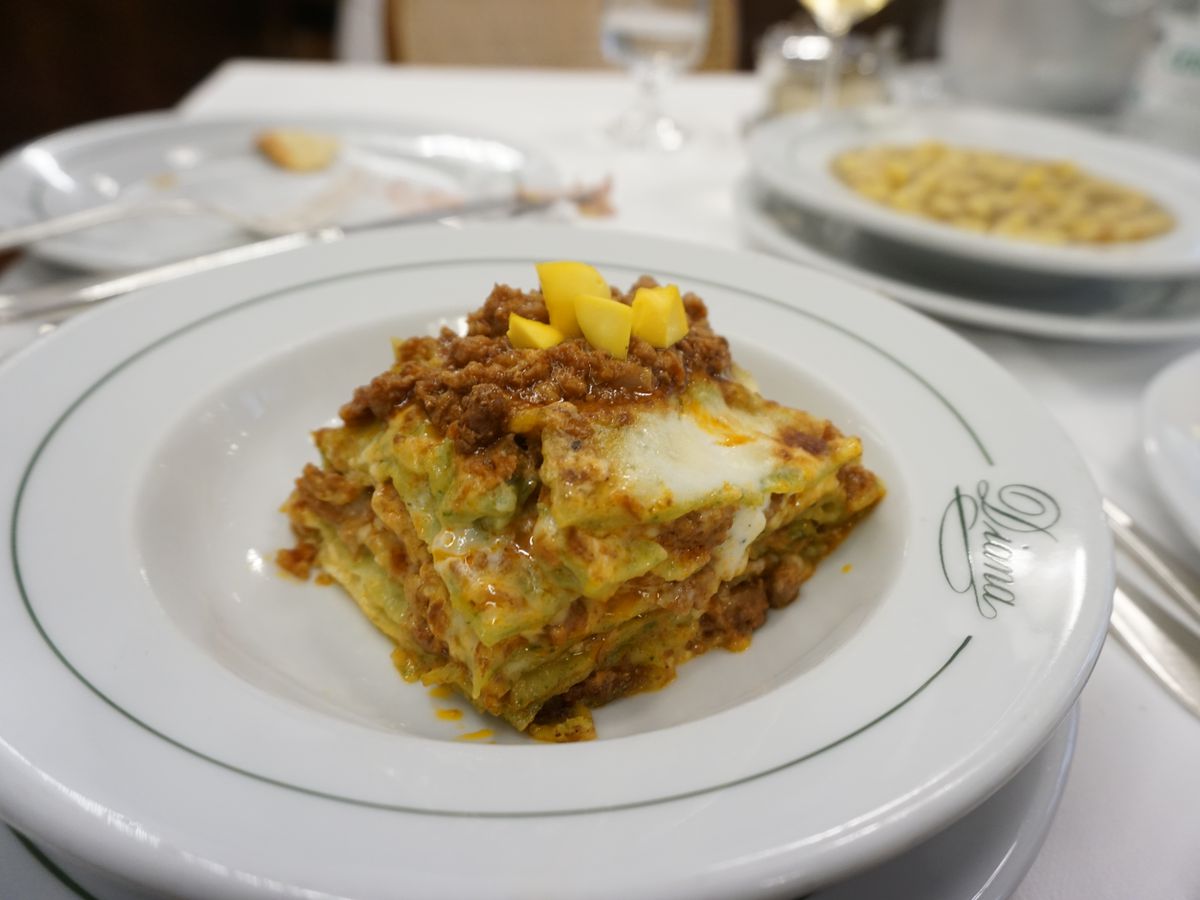 Lasagna heaped with cheese and additional meaty filling. 